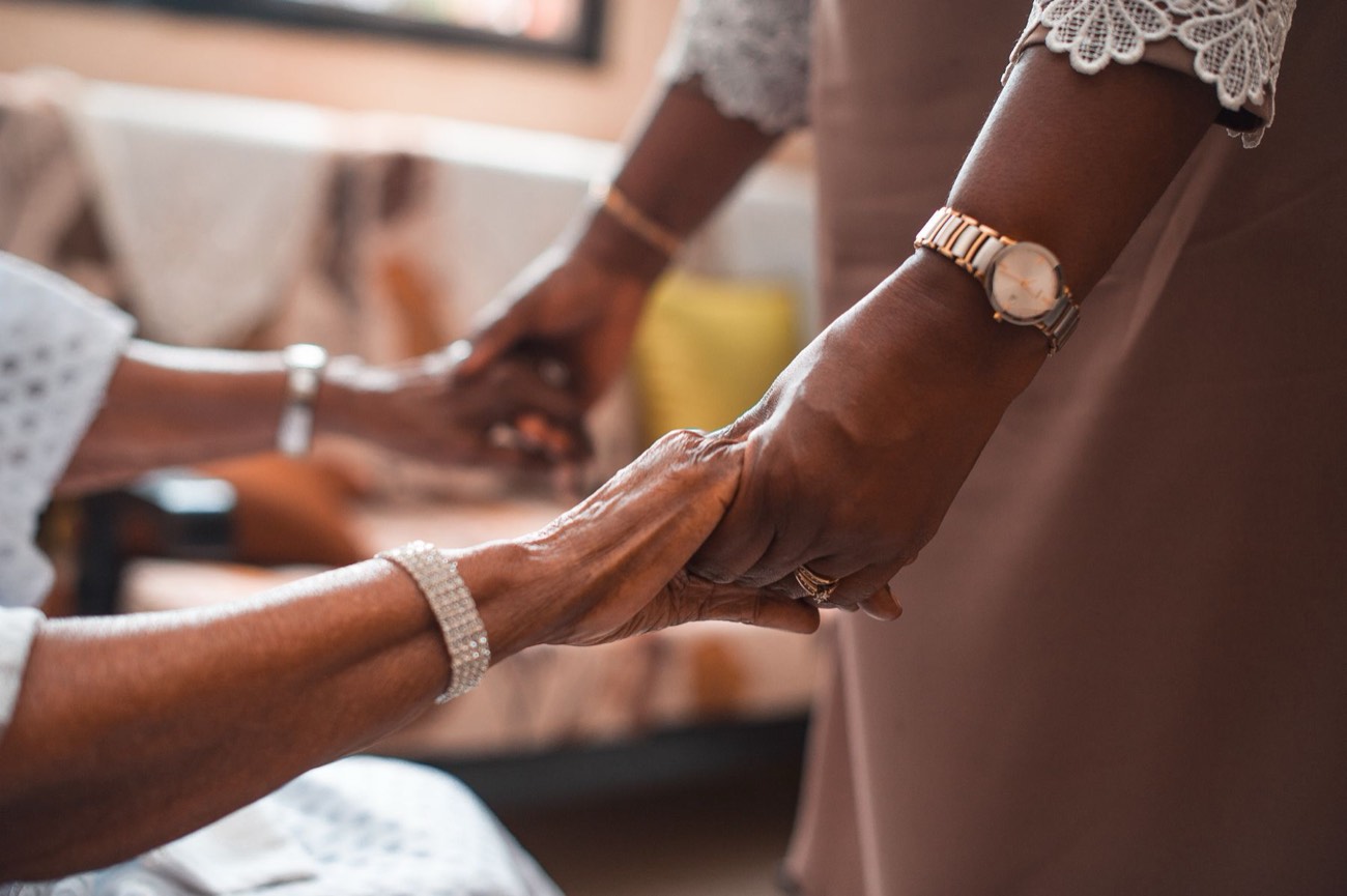 Two women holding hands